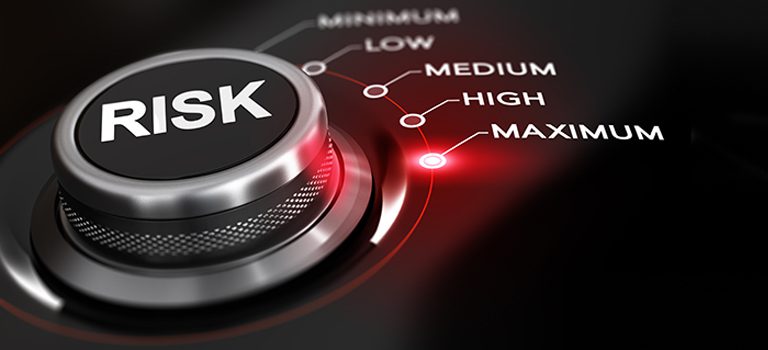 Switch button positioned on the word maximum black background and red light. Conceptual image for illustration of high level of risk management.