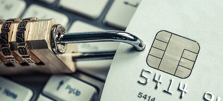 Cybersecurity Vulnerabilities lock on credit card on keyboard