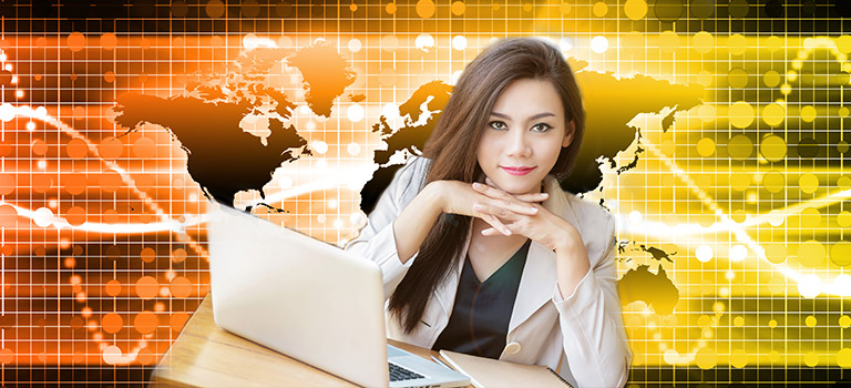 Confident business woman using computer against a backdrop of a map, staring confidently to address the gender gap
