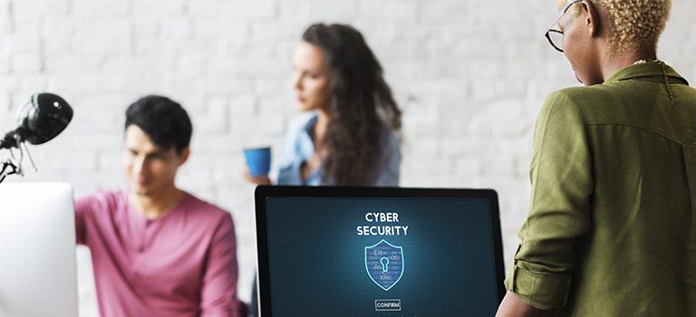 Woman on computer pursuing a career in cybersecurity, University of San Diego, USD, Cybersecurity Career