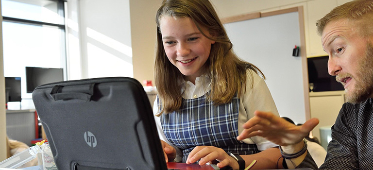 Cybersecurity Teach to Kids girl on Computer Education Classroom Teacher