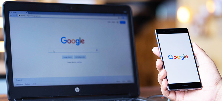 Google logo on laptop and phone